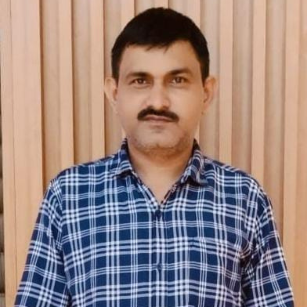 Portrait of Emily Clark, Customer Support Lead, a smiling woman with long hair wearing a casual blouse
